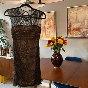 Bebe lace dress with jewels. Black with beige lining. Size S.